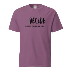 Purple t-shirt with 'DECIDE WITH COMPASSION' text.