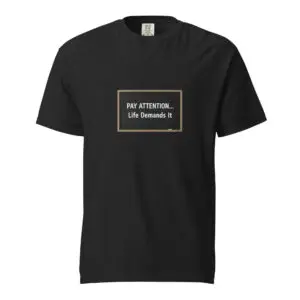 Black t-shirt with a motivational quote in a square frame.
