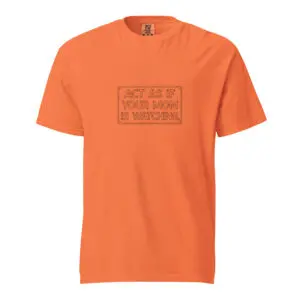 Orange t-shirt with a motivational quote printed on the chest.