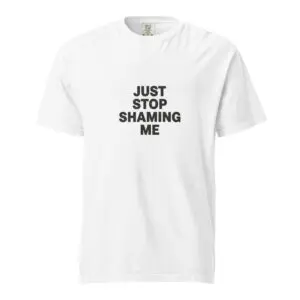 White t-shirt with bold text 'JUST STOP SHAMING ME'.